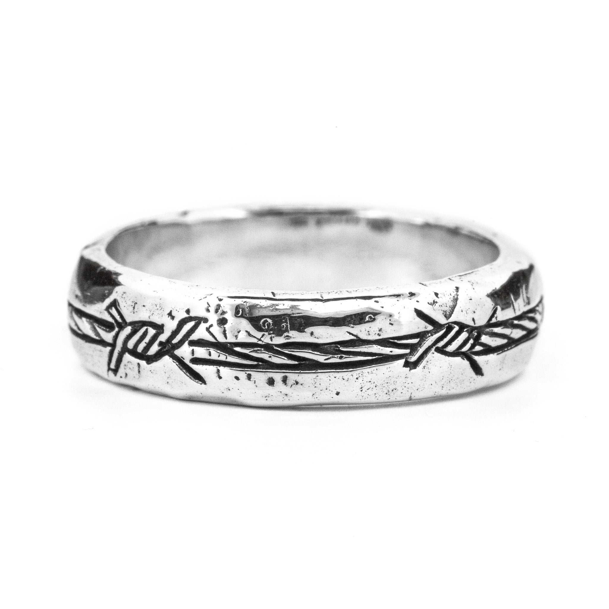 diamond ring wrapped in spiky barbed wire - AI Image